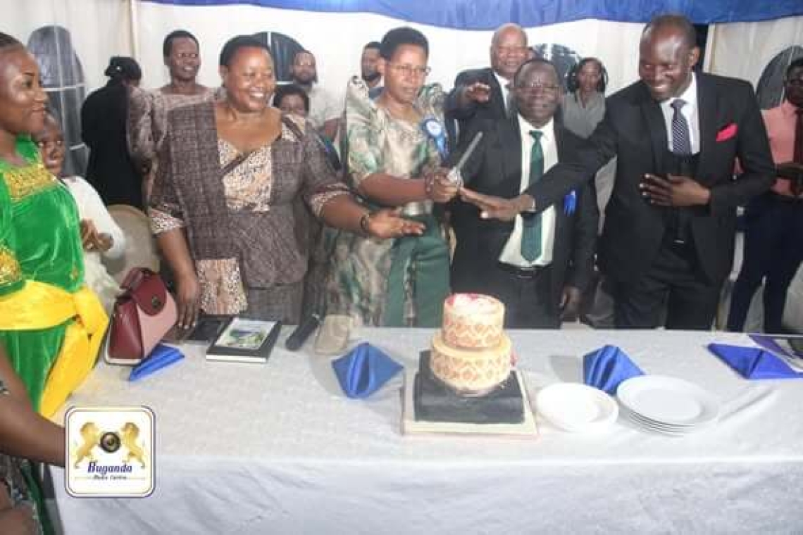 Owek. Noah Kiyimba (Right) with Archbishop Moses Maka cutting the cake. Owek. Noah Kiyimba (Right) with Archbishop Moses Maka cutting the cake.